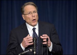 Wayne LaPierre  says the NRA will coordinate an effort to put former military and police officers in schools.