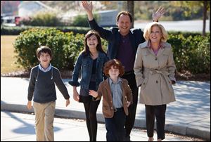 Billy Crystal as Artie and Bette Midler as Diane, who agree to babysit their three grandkids, from left, Joshua Rush as Turner, Bailee Madison as Harper and Kyle Harrison Breitkopf as Barker in a scene from the film, 