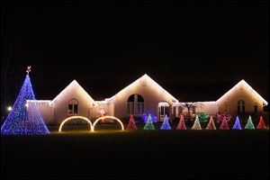The Tawil family has a computer-controlled Christmas lights show, matched by a low-power radio broadcast of Christmas songs on 91.9 FM, in the front yard of their home in Oregon.  