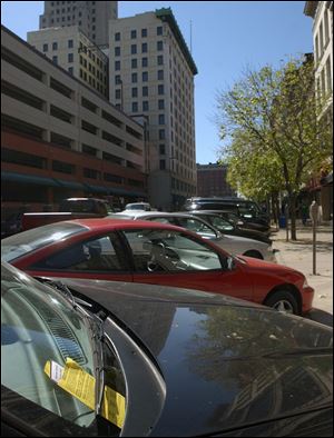 The Bell administration told the Downtown Toledo Parking Authority it could expand the types of tickets it writes to such spots as at fire hydrants and in loading zones and spaces for the disabled.