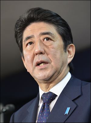 Japan's prime-minister-to-be Shinzo Abe speaks as he announces his top lieutenants today in Tokyo.