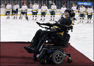 Former Clay High School player Kyle Cannon was par­a­lyzed af­ter be­ing hit during a game in November, 2008.