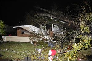 A house in the Midtown section of Mobile, Ala. is damaged after a tornado touched down Tuesday.