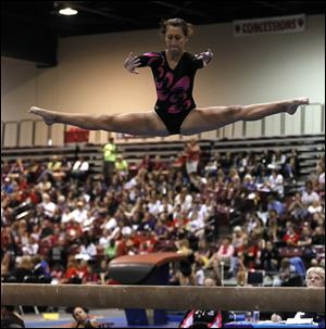 Megan Matrisciano performs on the balance beam in June at the YMCA National gymnastics championships at SeaGate Centre.