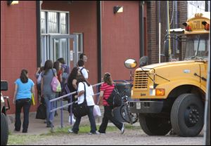 Students arrive for the first day of classes at the Harrold Independent School District in Harrold, Texas.  