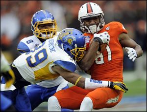San Jose State safety Cullen Newsome tackles Bowling Green wide receiver Chris Gallon in the first half of Thursday's Military Bowl in Washington. Gallon finished with seven catches for the Falcons, who finish with an 8-5 record.
