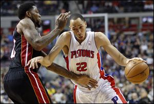 Detroit Pistons forward Tayshaun Prince drives against Miami Heat forward Udonis Haslem during the first half Friday in Auburn Hills, Mich.