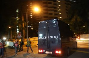 A police hearse leaves Mount Elizabeth Hospital on Saturday in Singapore. A young Indian woman who was gang-raped and severely beaten on a bus in New Delhi died Saturday at the hospital.
