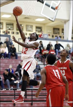 Central Catholic's C.J. Bussey, who had 13 points, goes to the basket against Bowling Green's Vitto Brown.