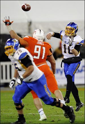 San Jose State quarterback David Fales passes against BG's Chris Jones. Fales completed 33 of 43 passes for 395 yards.