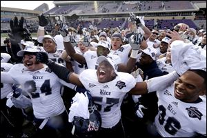 Rice linebacker Cameron Nwosu (57) celebrates with safety Paul Porras (24) and defensive end Dylan Klare (96) after their Armed Forces Bowl winagainst Air Force.