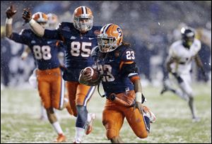 Syracuse wide receiver Jarrod West (88) and tight end Beckett Wales (85) begin to celebrate as running back Prince-Tyson Gulley runs for a touchdown against West Virginia during the Pinstripe Bowl.