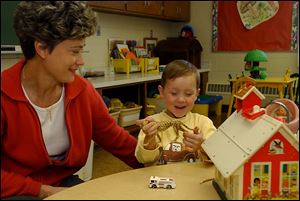 Lisa Wurster, shown here with adopted son Peter in 2004, adopted two sons from Russia. She is president of Sylvania-based Friends of Russian Orphans. 