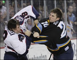 Toledo's Phil Rauch, right, lands a punch on Kalamazoo's Tyler Shelast during a fight in the second.