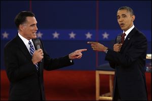 Republican presidential nominee Mitt Romney and President Obama spar during the second presidential debate in Hempstead, N.Y.