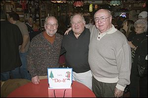 From left, hosts Jeff James, Bob Wasserman, and Ron Buermele at the 46th annual Do-It Party at the Players Club.