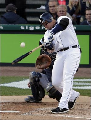 Detroit's Miguel Cabrera hits a two-run home run in the ACLS against the Yankees. Cabrera was selected as the AL MVP and was the first player to win the batting triple crown since 1967.