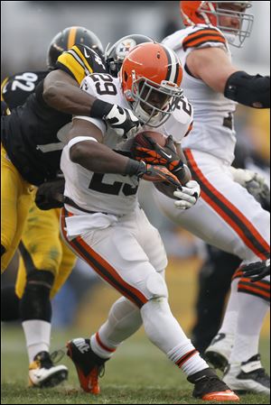 Cleveland Browns running back Brandon Jackson is tackled by Steelers inside linebacker Lawrence Timmons in the first half Sunday in Pittsburgh. The Browns lost 24-10.