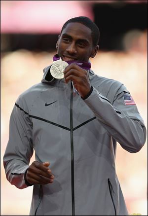 Erik Kynard shows off his Olympic silver medal for the high jump at the London Games.