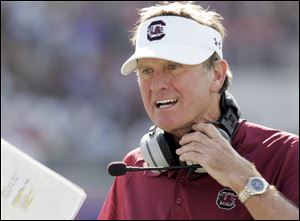 South Carolina's Steve Spurrier has won more than 200 college football games as head coach at Duke, Florida, and with the Gamecocks. He takes his squad into their seventh bowl game in the last eight years on Tuesday against Michigan.