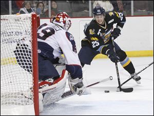The Walleye's Ben Youds looks to shoot on Kalamazoo goaltender Joel Martin in the first period. Martin made 30 saves to help beat Toledo.
