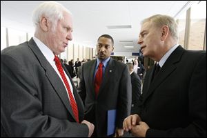 Willard & Kelsey’s Michael Cicak, left talks with then-Gov. Ted Strickland during Mr. Strickland’s visit to the Perrysburg solar firm in 2010.