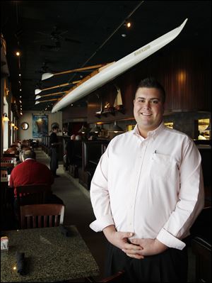 Jonathan McQueary is the manager at Forrester’s on the River, which opened its doors Wednesday.  He and his father, John McQueary, will run the steak-house-style restaurant in the spot once occupied by Navy Bistro and, most recently, Admiral’s American Grill.