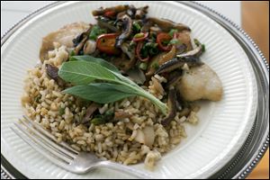 Chinese-styled steamed tilapia is shown served on a plate. As is typical in Chinese cuisine, the secret is in the seasoning. 