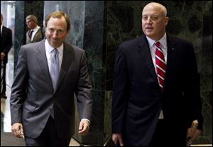 NHL commissioner Gary Bettman, left, and Bill Daly, deputy commissioner and chief legal officer, following collective bargaining talks in Toronto.