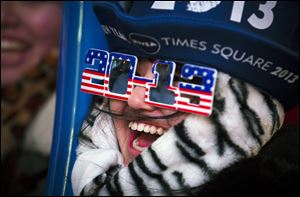 Konomi Miwa, 19, of Japan, cheers in Times Square for the New Year's Eve celebration, Monday in New York. 
