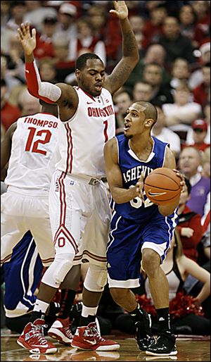 Ohio State's Deshaun Thomas defends UNC-Asheville's Will Weeks. OSU is seeking to find a second scoring option after Thomas.