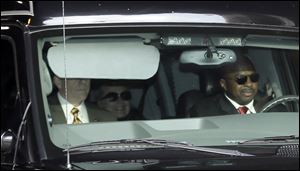 Secretary of State Hillary Clinton, center, is transported on the New York Presbyterian Hospital complex in New York.