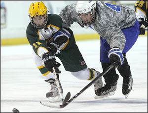 Clay’s James LaPlante, left, and Anthony Wayne’s Chris Miller battle for the puck. Miller leads the Generals with 17 goals.