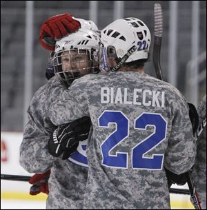 AW’s Mike McDougall, left, is congratulated for his goal by Chad Bialecki.