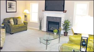 The sunny great room is highlighted by a cozy fireplace, which lights at the flick of a switch.