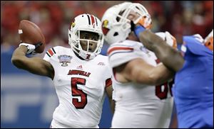 Louisville quarterback Teddy Bridgewater was 20 of 32 passing for 266 yards and two touchdowns against the heavily favored Gators..