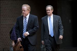 Sen. Michael Crapo (R., Idaho), right, arrives at Alexandria General District Court in Alexandria, Va
