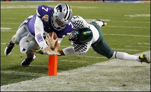Kansas State quarterback Collin Klein threw for 151 yards on 17 of 32 passing and also added a rushing touchdown on this play.