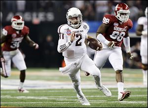 Texas A&M's Johnny Manziel finds a lot of running room against Oklahoma. Johnny Football set a Cotton Bowl record with 516 yards of offense.