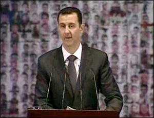Syrian President Bashar Assad speaks at the Opera House in central Damascus, Syria. Syrian President Bashar Assad on Sunday outlined a new peace initiative that includes a national reconciliation conference and a new government and constitution.