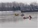 firefighers-coast-guard-rescue.jpg Washington Township firefighters and members of the Coast Guard work to rescue a woman from the ice on the Maumee River.