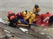 pull-man-to-shore.jpg Firefighters pull a woman from a Washington Township fire department boat onto the docks along the Maumee River near Imagination Station after rescuing her from the ice.