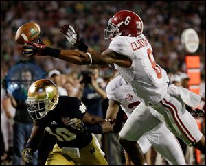 Alabama's Ha'Sean Clinton-Dix (6) intercepts a pass over Notre Dame's DaVaris Daniels (10) during the second half of the BCS National Championship college football game in Miami.