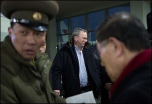 Executive Chairman of Google Eric Schmidt, center, arrives at Pyongyang International Airport in Pyongyang, North Korea today. Schmidt arrived in the North Korean capital along with former New Mexico Gov. Bill Richardson.