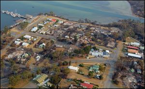 This aerial photo shows a view of Dunalley after a wildfire destroyed around 80 buildings in and around the small town, east of the Tasmanian capital of Hobart, Australia, Saturday.