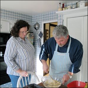 Toledoans Theresa Carroll and Tom Dimit make a quick bread. Ms. Carroll, Mr. Dimit's girlfriend, has been his caregiver since he had a life-changing stroke in October, 2011, that left him visually impaired. 