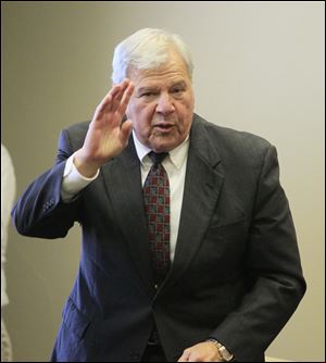 Retiring sheriff James Telb is acknowledged after Maj. John Tharp is sworn in as sheriff Monday at the Lucas County Courthouse.