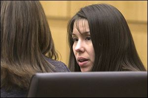 Defendant, Jodi Arias, listens during the prosecution's opening statements in Maricopa County court in Phoenix.