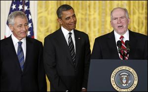President Obama and his choice for Defense Secretary, former Nebraska Sen. Chuck Hagel, left, listen as the president's choice for CIA Director, Deputy National Security Adviser for Homeland Security and Counterterrorism, John Brennan, right, speaks at the White House Monday.