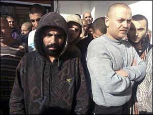 Freed Syrian prisoners released by the Syrian government are seen in Damascus, Syria, today.